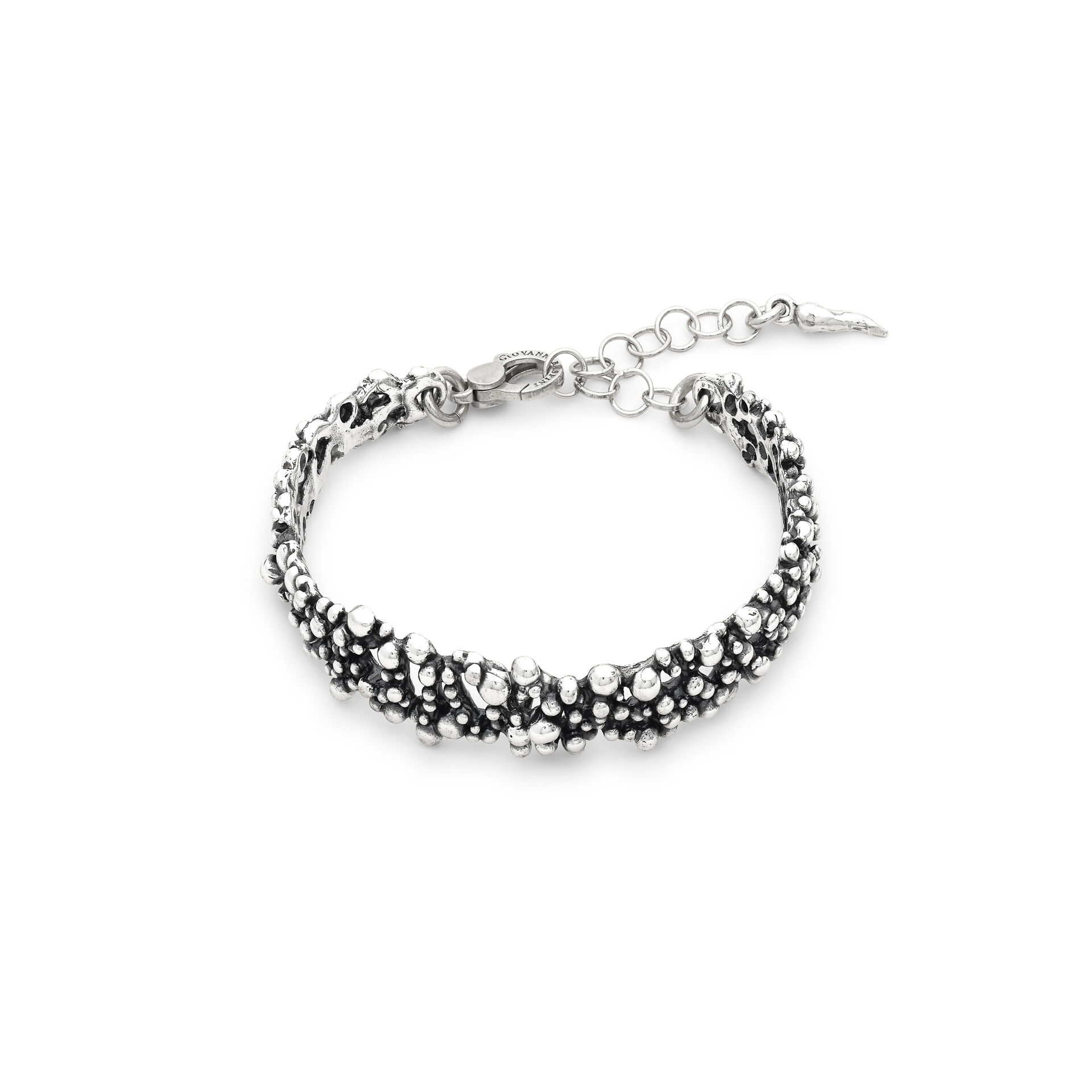 Small spheres are the sole protagonists of this bangle. Made using the lost-wax casting technique and burnished to a warm finish, this piece evokes small champagne bubbles, creating delicate plays of light. Crafted by hand in our own workshop.