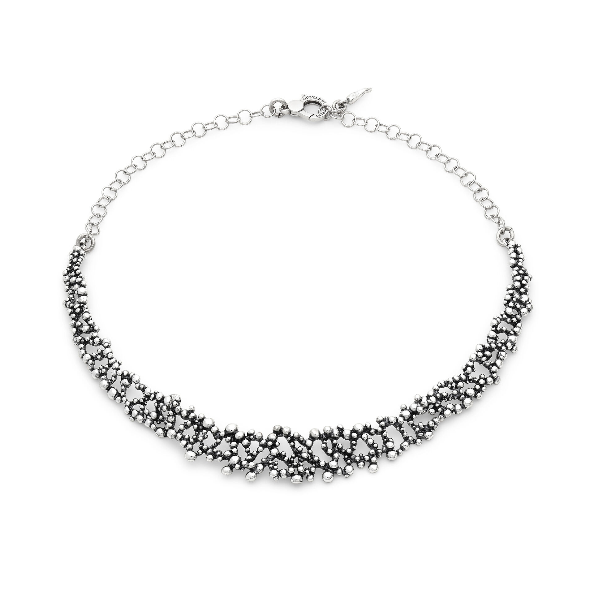 In this necklace, sparkling decorations catch the eye along the wearer's neckline. Made using the ancient lost-wax casting technique and burnished to a warm finish, this piece evokes small champagne bubbles chasing one another, creating delicate plays of light. A striking yet comfortable necklace, perfectly suited to everyday wear for those who wish to express themselves through a work of art. Handcrafted in our own workshop.