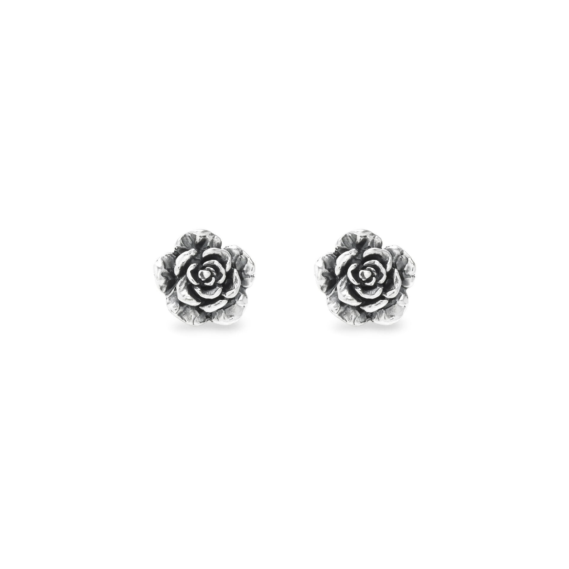 Created using the ancient lost-wax casting technique, these burnished silver earrings are inspired by roses. Detailed petals interpret the beauty of the flower with a natural flair, creating a piece of jewellery brimming with timeless elegance. Handmade in our workshop.